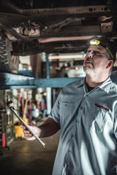 Visor clip attached to brim of cap for Bandit Pro headlamp